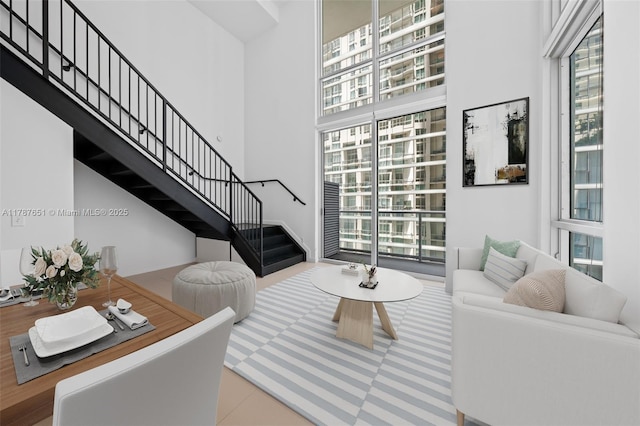 300 S Biscayne Blvd Unit L-802, Miami, FL 33131 - living room featuring plenty of natural light, stairs, and a high ceiling