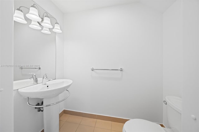 300 S Biscayne Blvd Unit L-802, Miami, FL 33131 - bathroom featuring toilet, tile patterned floors, and baseboards