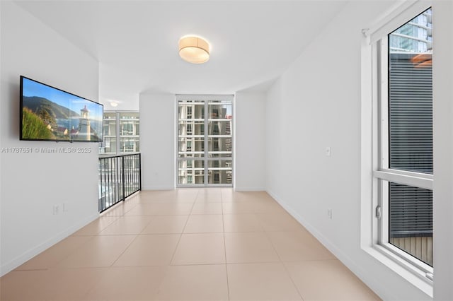 300 S Biscayne Blvd Unit L-802, Miami, FL 33131 - empty room featuring baseboards, floor to ceiling windows, and tile patterned flooring