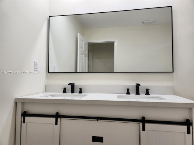 bathroom with a sink and double vanity