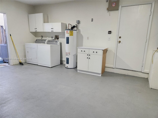 washroom with water heater, washing machine and clothes dryer, and cabinet space