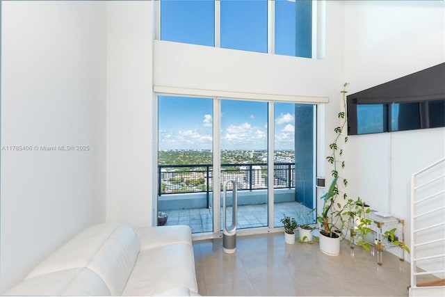 60 SW 13th St Unit 2609, Miami, FL 33130 - living room featuring tile patterned flooring and a high ceiling