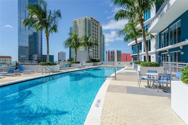 60 SW 13th St Unit 2609, Miami, FL 33130 - community pool with a view of city and a patio area