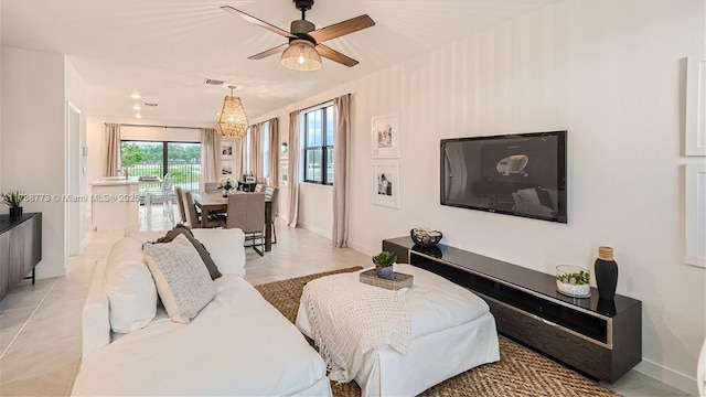 1326 NE 3rd Ave, Florida City, FL 33034 - living area with visible vents, a ceiling fan, baseboards, and light tile patterned floors