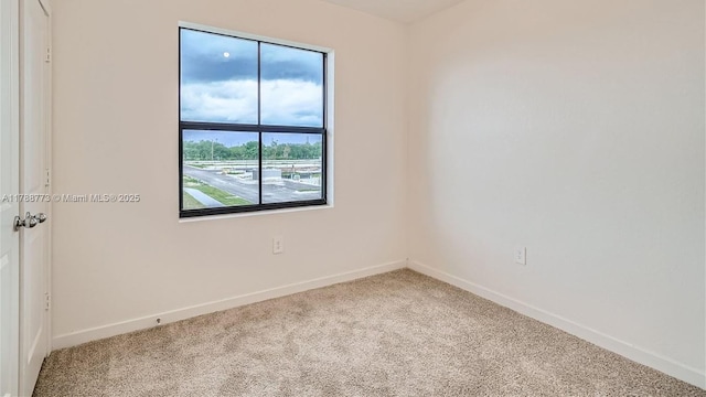 1326 NE 3rd Ave, Florida City, FL 33034 - unfurnished room featuring baseboards and carpet