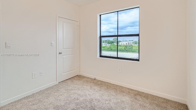 1326 NE 3rd Ave, Florida City, FL 33034 - spare room with light colored carpet and baseboards
