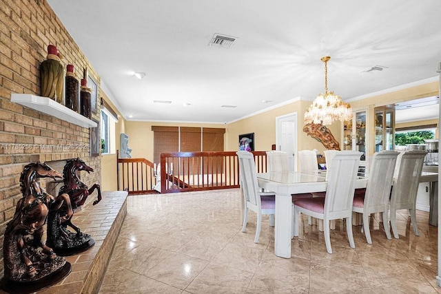 dining room with a chandelier, visible vents, crown molding, and marble finish floor