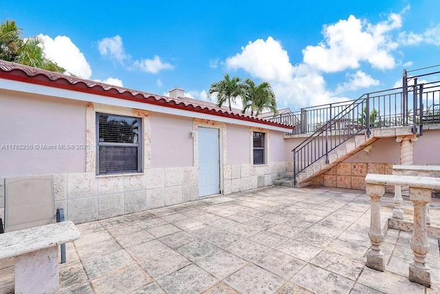 view of patio / terrace with stairway