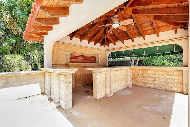 view of patio / terrace featuring a gazebo, a ceiling fan, and exterior kitchen