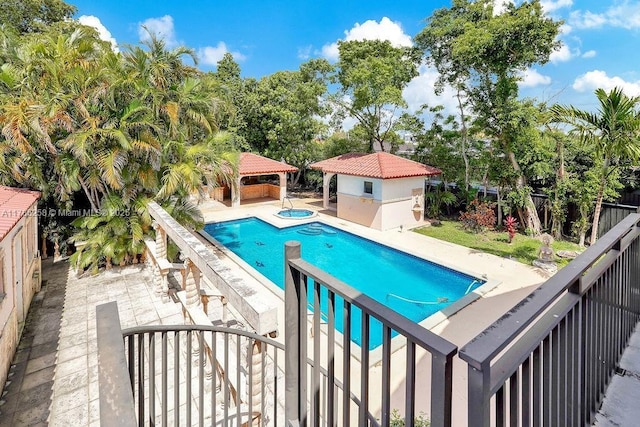 view of pool featuring a gazebo, a patio area, a fenced backyard, a fenced in pool, and an in ground hot tub