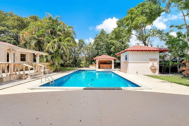 outdoor pool featuring a patio area and a gazebo