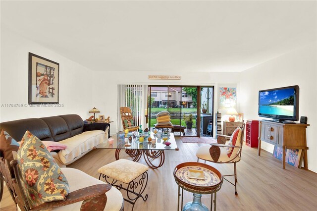 3904 Estepona Ave Unit 8D2, Doral, FL 33178 - living room featuring light wood finished floors