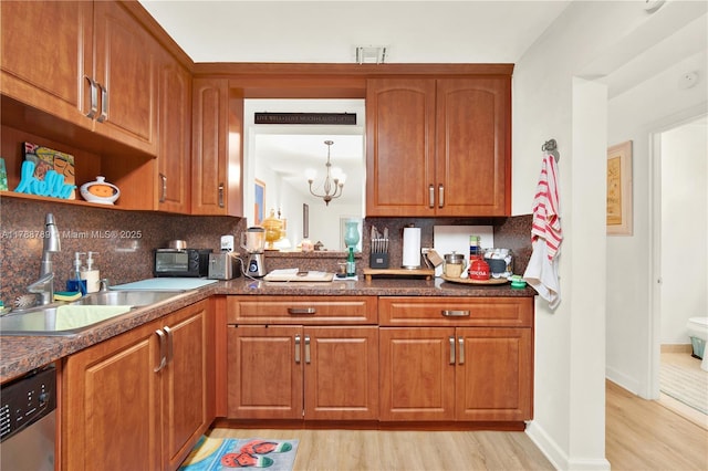 3904 Estepona Ave Unit 8D2, Doral, FL 33178 - kitchen featuring a sink, light wood-style flooring, stainless steel dishwasher, brown cabinets, and backsplash