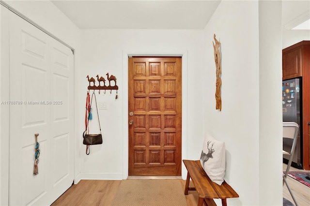 3904 Estepona Ave Unit 8D2, Doral, FL 33178 - foyer with light wood finished floors and baseboards