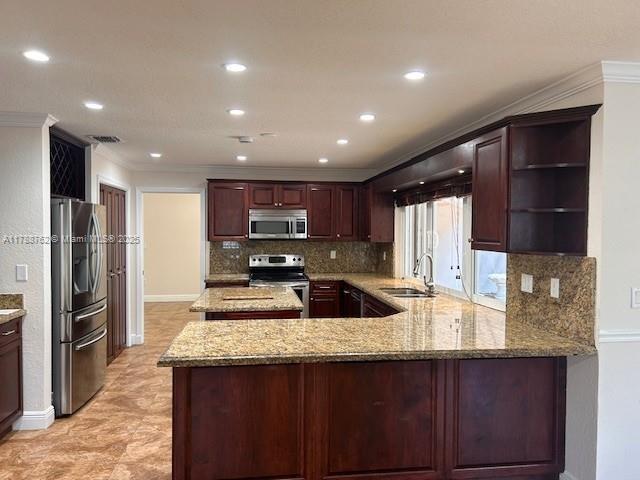 15242 SW 147th Ter, Miami, FL 33196 - kitchen with appliances with stainless steel finishes, a sink, crown molding, decorative backsplash, and open shelves