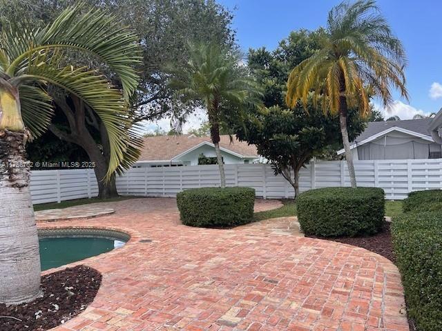 15242 SW 147th Ter, Miami, FL 33196 - view of pool with a fenced backyard and a patio
