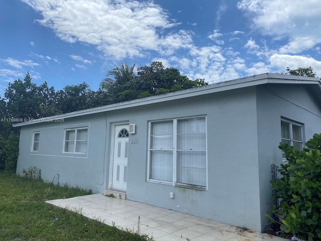 back of property with stucco siding