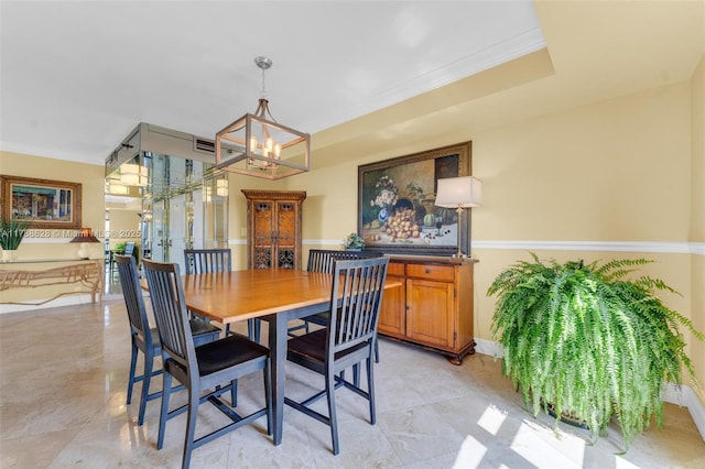 2000 Towerside Ter Unit 702, Miami, FL 33138 - dining space featuring crown molding, baseboards, and a notable chandelier