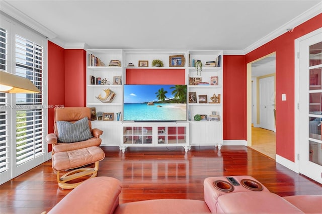 2000 Towerside Ter Unit 702, Miami, FL 33138 - living area featuring a healthy amount of sunlight, ornamental molding, and hardwood / wood-style flooring