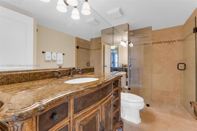 2000 Towerside Ter Unit 702, Miami, FL 33138 - bathroom with vanity, toilet, tile patterned floors, a shower stall, and visible vents