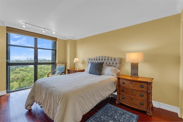 2000 Towerside Ter Unit 702, Miami, FL 33138 - bedroom with track lighting, baseboards, ornamental molding, and hardwood / wood-style flooring