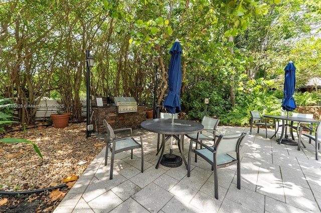 2000 Towerside Ter Unit 702, Miami, FL 33138 - view of patio / terrace featuring an outdoor kitchen, outdoor dining area, and a grill