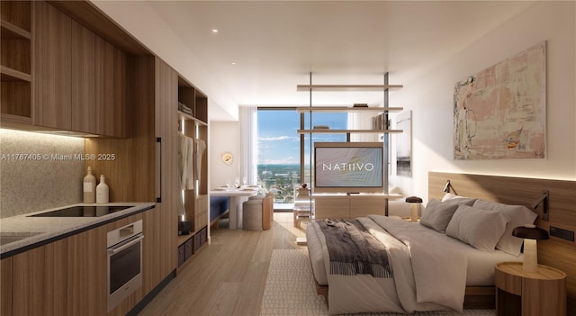 bedroom featuring light wood-type flooring and a wall of windows