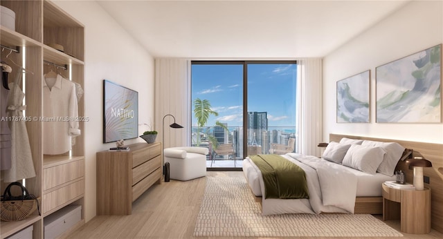bedroom with a wall of windows and light wood-style floors