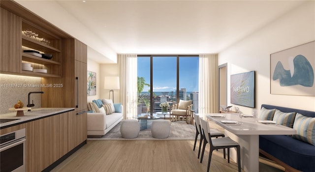 200 W Broward Blvd Unit 2602, Fort Lauderdale, FL 33301 - living area featuring a wall of windows and light wood finished floors