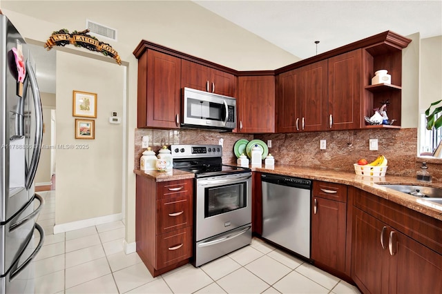 3939 Adra Ave Unit A-47, Doral, FL 33178 - kitchen featuring decorative backsplash, stainless steel appliances, visible vents, and light tile patterned floors
