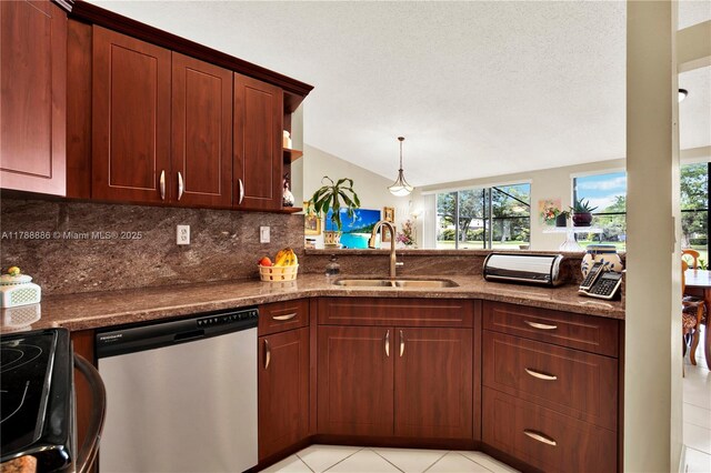 3939 Adra Ave Unit A-47, Doral, FL 33178 - kitchen with stainless steel dishwasher, a sink, dark stone countertops, tasteful backsplash, and vaulted ceiling