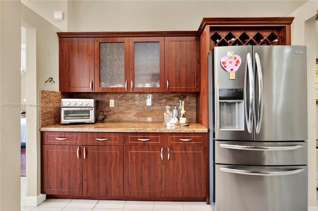 3939 Adra Ave Unit A-47, Doral, FL 33178 - kitchen featuring tasteful backsplash, glass insert cabinets, stainless steel fridge with ice dispenser, a toaster, and light stone countertops