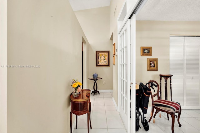 3939 Adra Ave Unit A-47, Doral, FL 33178 - hall featuring baseboards, french doors, and light tile patterned floors