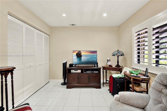 3939 Adra Ave Unit A-47, Doral, FL 33178 - living area with visible vents, recessed lighting, and light tile patterned floors