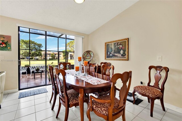 3939 Adra Ave Unit A-47, Doral, FL 33178 - dining space with vaulted ceiling, baseboards, a textured ceiling, and light tile patterned floors