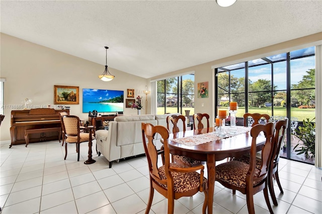 3939 Adra Ave Unit A-47, Doral, FL 33178 - dining space with lofted ceiling, a textured ceiling, and light tile patterned floors