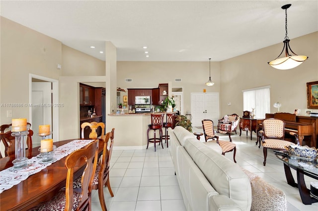 3939 Adra Ave Unit A-47, Doral, FL 33178 - interior space featuring high vaulted ceiling, recessed lighting, and light tile patterned floors
