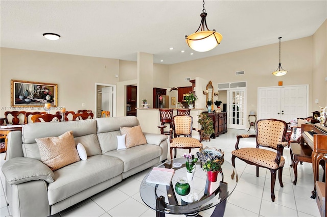 3939 Adra Ave Unit A-47, Doral, FL 33178 - living room featuring light tile patterned flooring, visible vents, and high vaulted ceiling