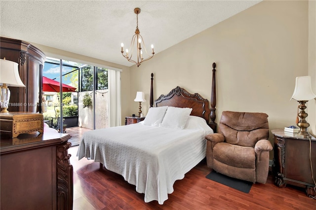 3939 Adra Ave Unit A-47, Doral, FL 33178 - bedroom with lofted ceiling, dark wood-style flooring, a chandelier, and access to exterior