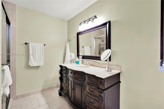 3939 Adra Ave Unit A-47, Doral, FL 33178 - bathroom with baseboards, vanity, tile patterned flooring, and a tile shower