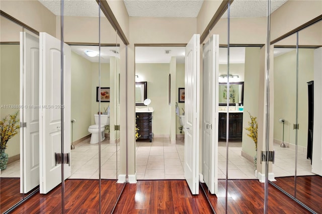 3939 Adra Ave Unit A-47, Doral, FL 33178 - interior space featuring baseboards, wood finished floors, and a textured ceiling