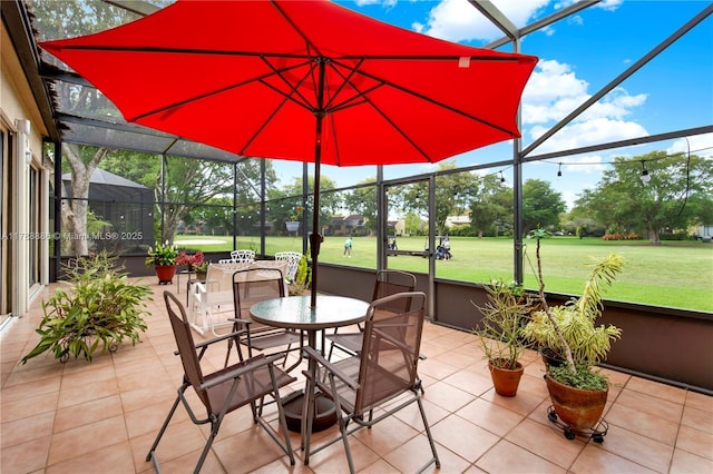 3939 Adra Ave Unit A-47, Doral, FL 33178 - view of patio featuring glass enclosure, outdoor dining space, and view of golf course