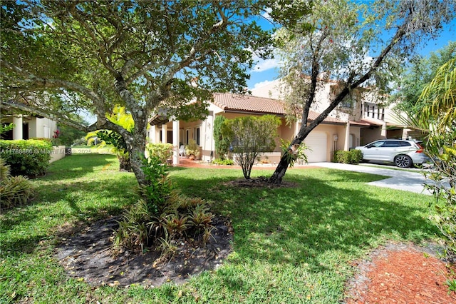 3939 Adra Ave Unit A-47, Doral, FL 33178 - view of front of property featuring a tile roof, a front yard, stucco siding, and driveway
