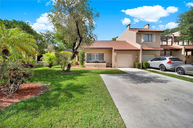3939 Adra Ave Unit A-47, Doral, FL 33178 - view of front facade with a tiled roof, a front lawn, concrete driveway, stucco siding, and a garage