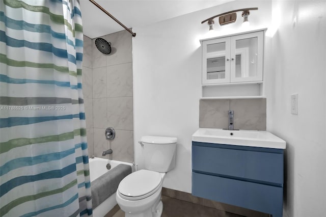 bathroom with toilet, vanity, and shower / bath combo with shower curtain