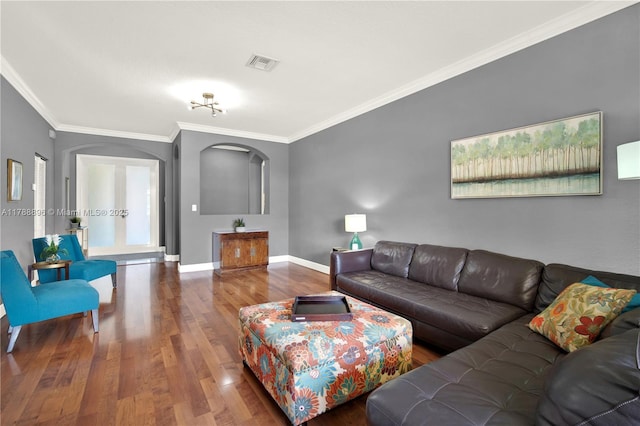 20656 SW 89th Ave, Cutler Bay, FL 33189 - living room featuring wood finished floors, visible vents, crown molding, and arched walkways