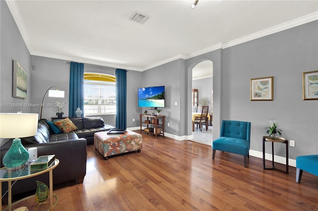20656 SW 89th Ave, Cutler Bay, FL 33189 - living area featuring visible vents, baseboards, ornamental molding, arched walkways, and wood finished floors