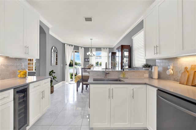 20656 SW 89th Ave, Cutler Bay, FL 33189 - kitchen with stainless steel dishwasher, a sink, beverage cooler, visible vents, and marble finish floor