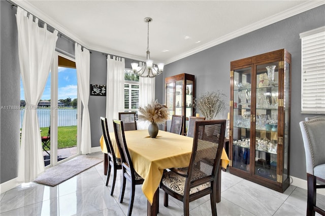 20656 SW 89th Ave, Cutler Bay, FL 33189 - dining space with a chandelier, crown molding, a water view, and baseboards