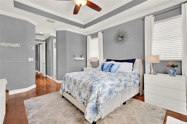 20656 SW 89th Ave, Cutler Bay, FL 33189 - bedroom with wood finished floors, ornamental molding, baseboards, visible vents, and a ceiling fan